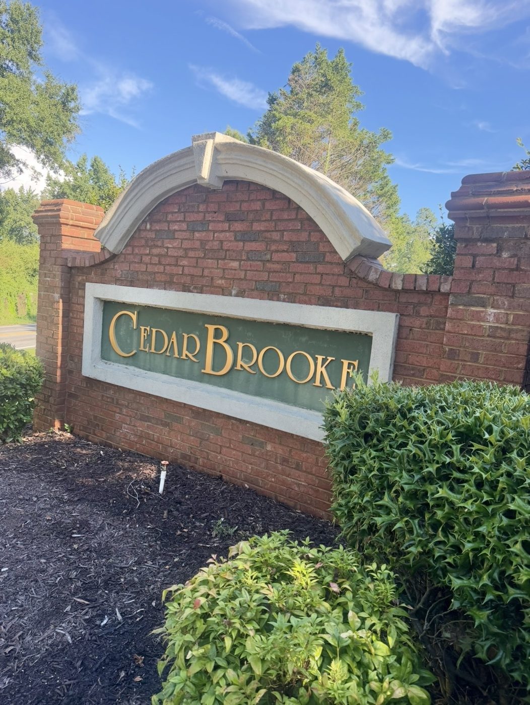 Cedar Brooke entrance sign from the side after cleaning