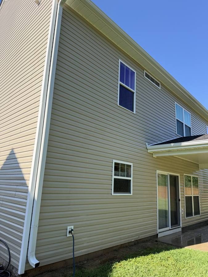 Two-story house after soft wash, clean vinyl siding, Greenwood SC